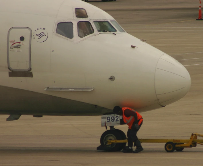 a person putting their luggage on a cart