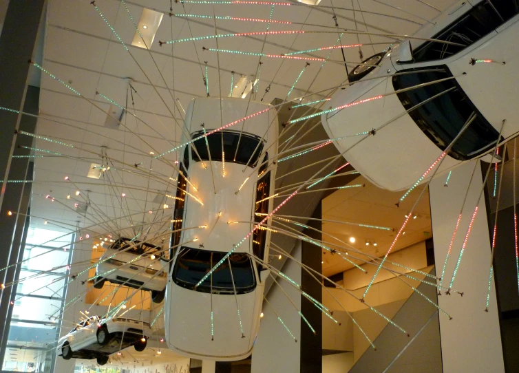 a car with lights is being displayed in a showroom