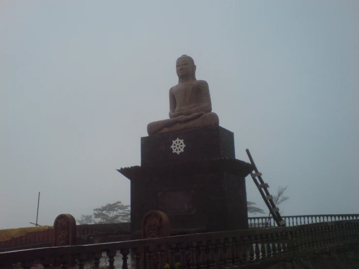 a large statue is standing in the middle of a wall