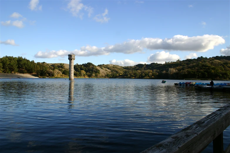 the pier is empty on a lake