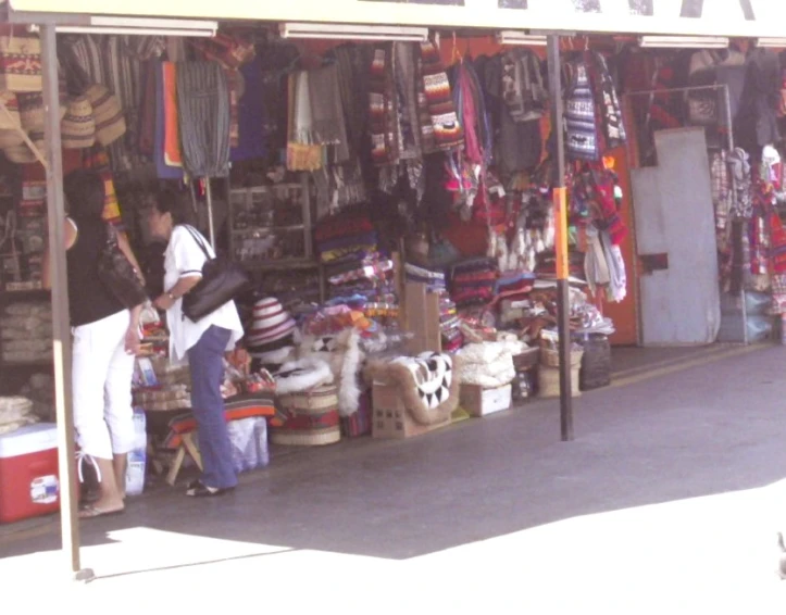 a man and a woman shop at a small store