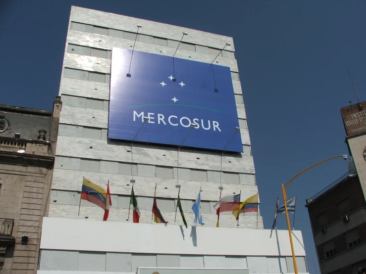 a large blue sign on the side of a building