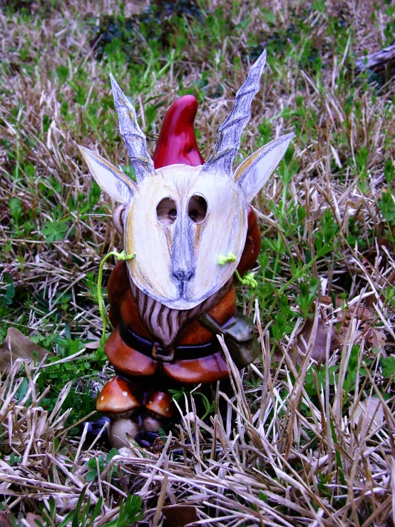 a chicken wearing a jacket with horns and ears