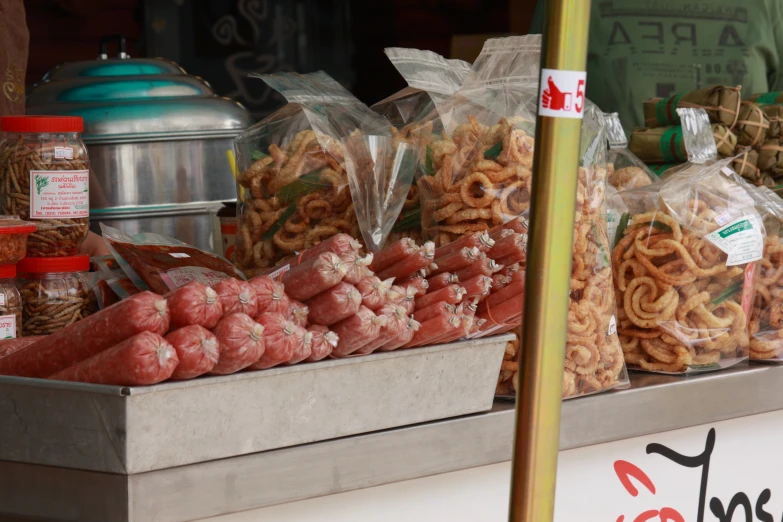 a street vendor has his food on display