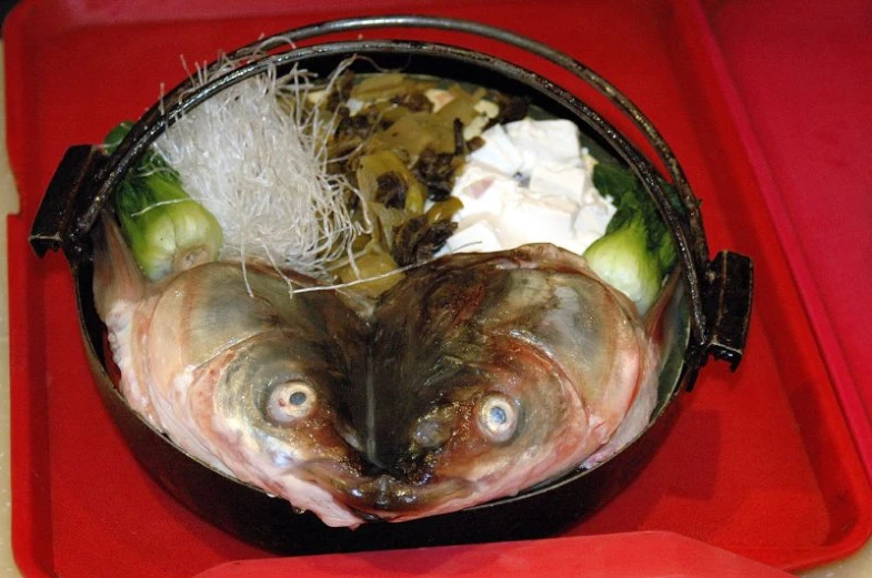 the prepared fish in the bowl is ready to be eaten