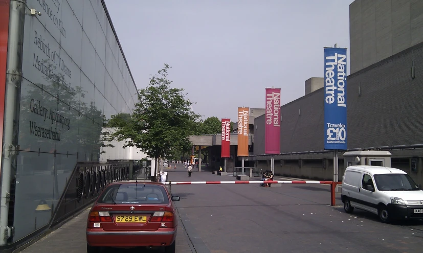 the car is parked along the street by the curb