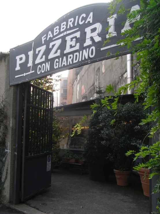 the entrance to a garden and flower shop