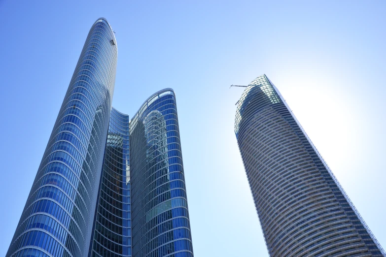 two tall skyscrs in a clear blue sky