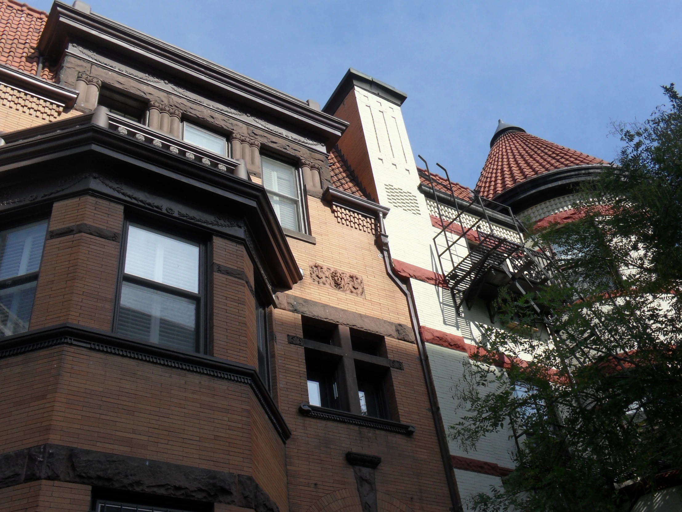 a closeup of an old building with many windows