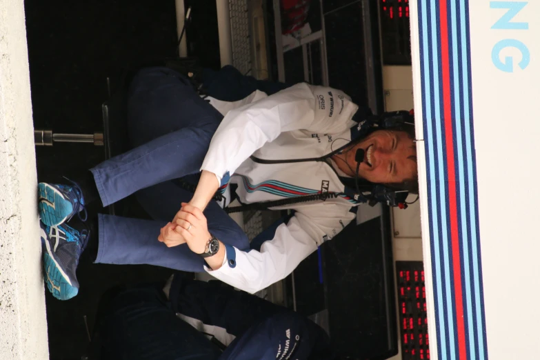 a man sitting in the dugout under a covering