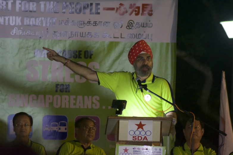 a man standing at a podium giving a speech