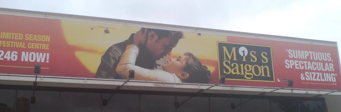 a poster of a movie starring actors on a billboard