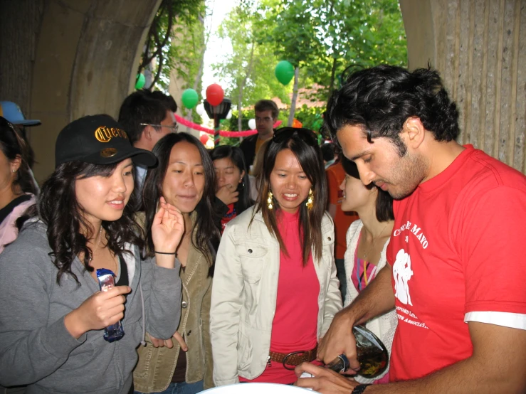 people in line with their cell phones at an event