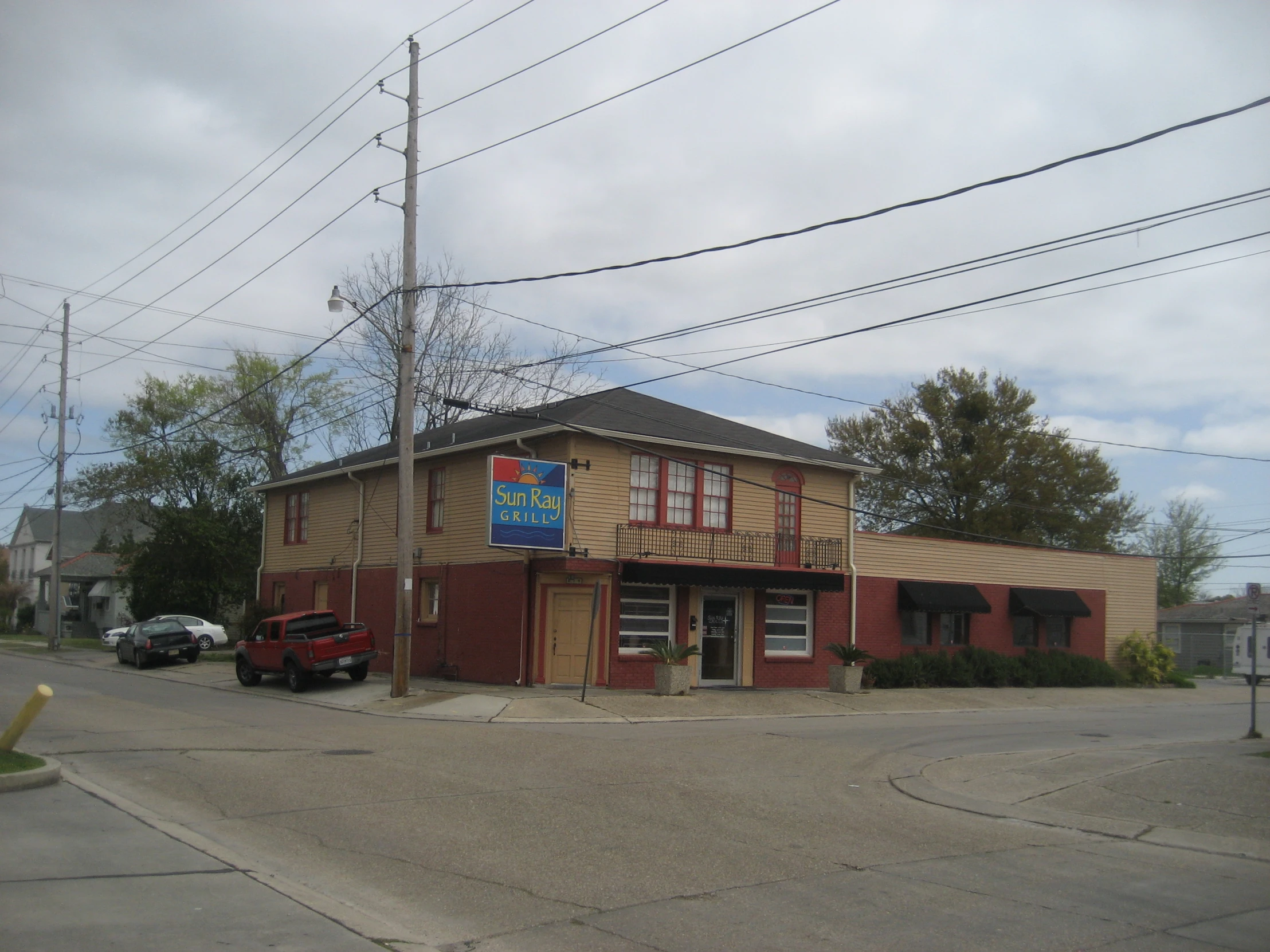 a restaurant sitting on the corner of a city street