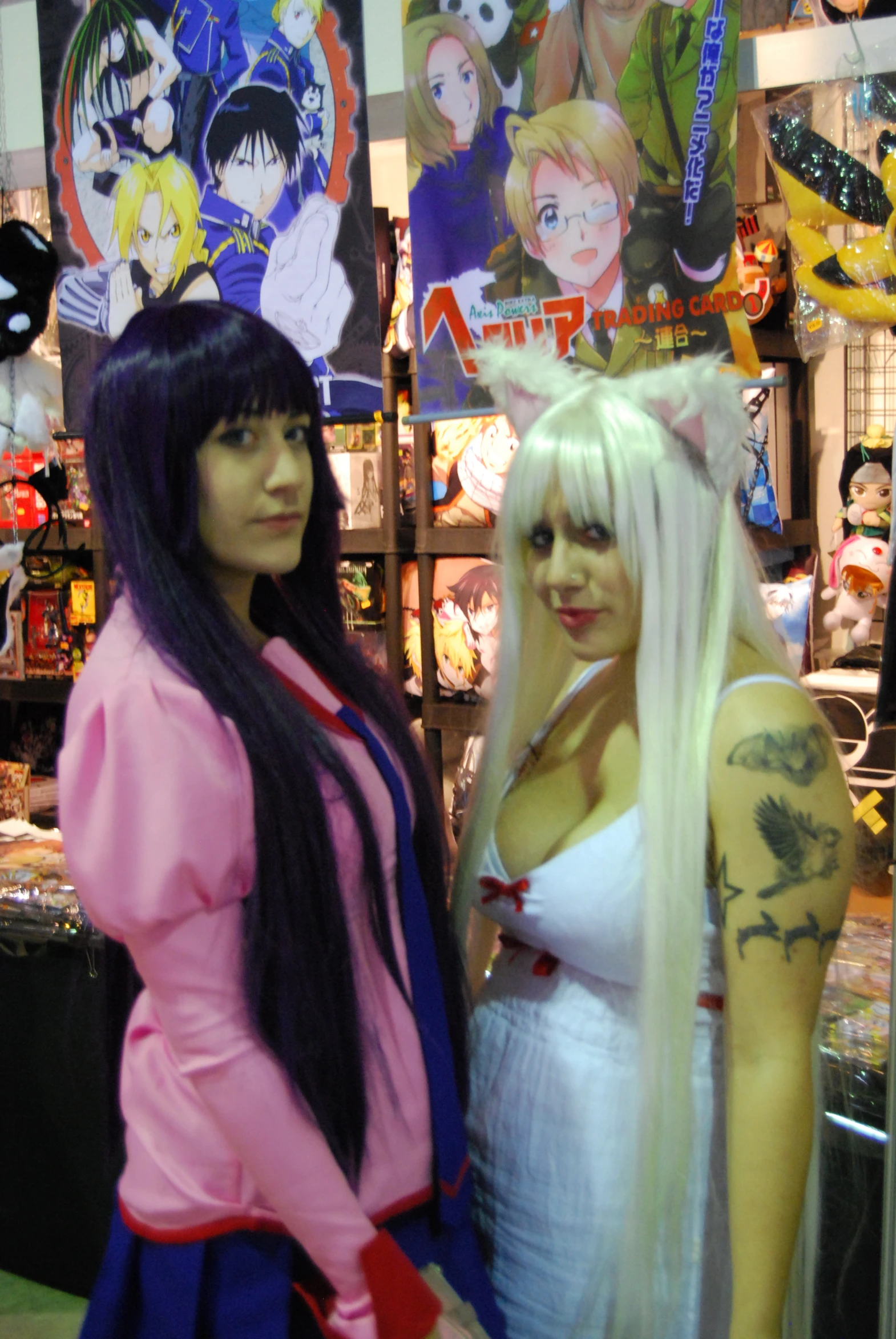 two girls dressed in costumes posing for a po