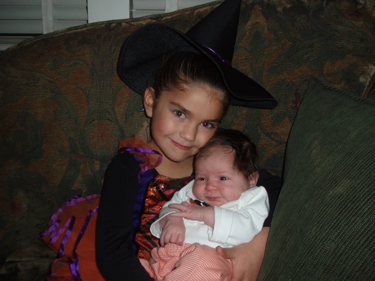  and baby dressed up like witches