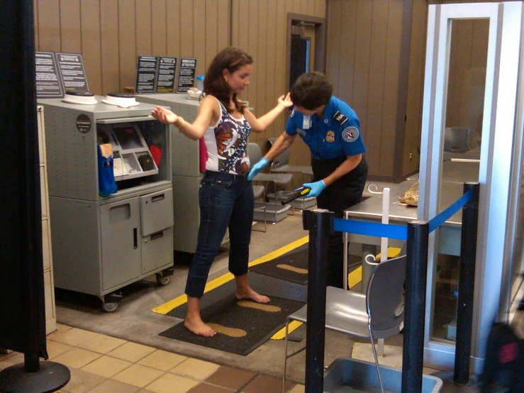 a person is cleaning the inside of an atm machine