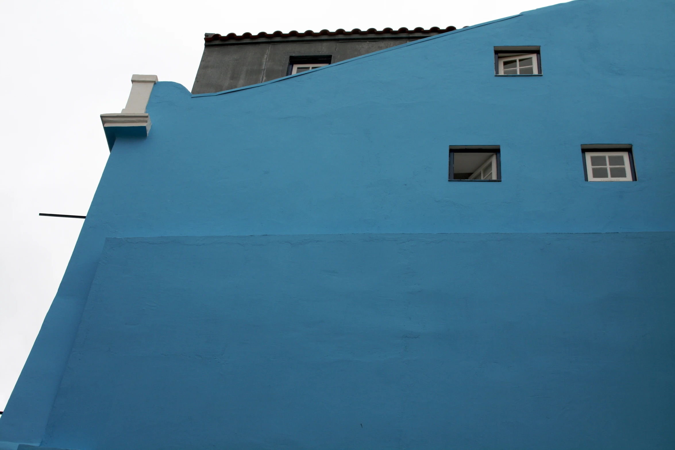 blue building with windows facing different directions