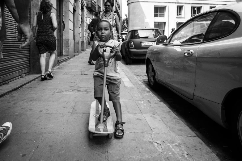 black and white pograph of a boy on skateboard