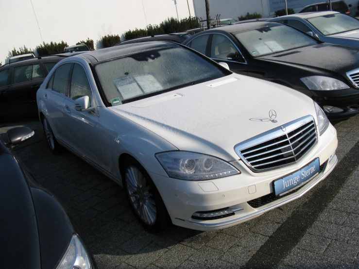 a mercedes benz is parked in a parking lot