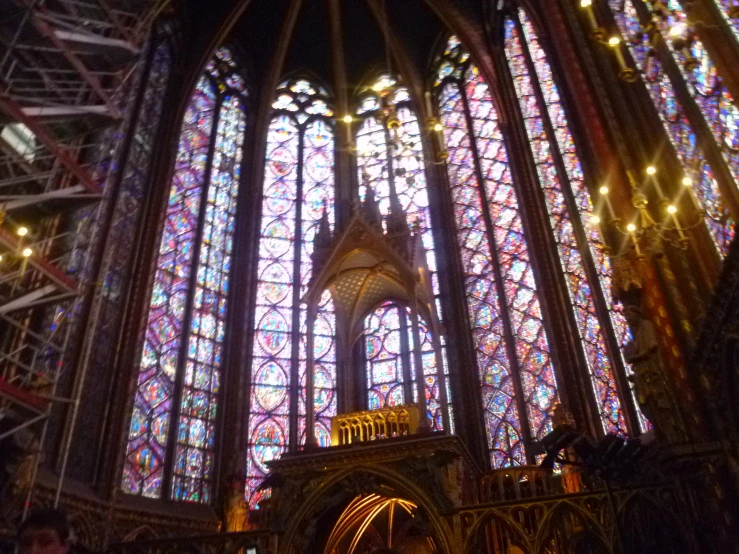 the large, intricate stained glass window inside a building