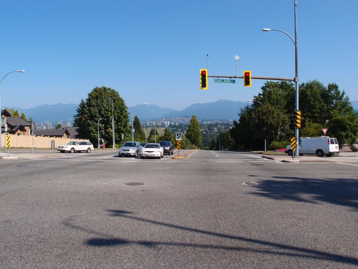 traffic is waiting to be stopped at a stop light