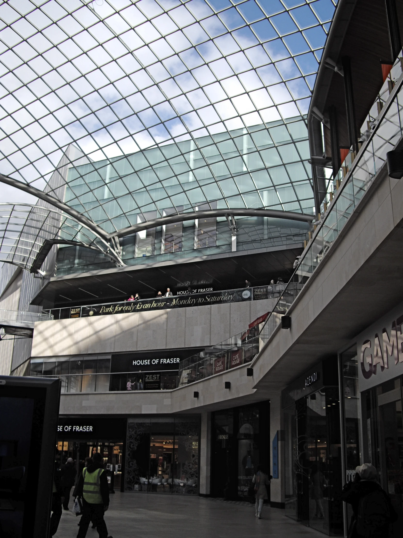 a big building with people walking around inside it