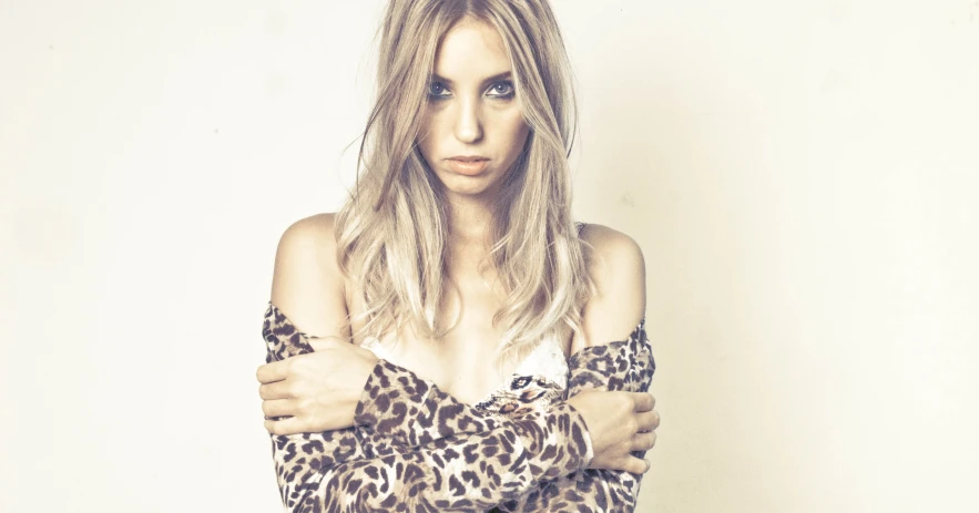 woman in leopard top with dark shadow and hair