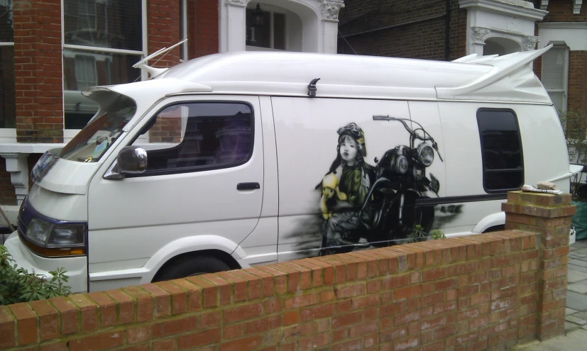 the van has two people painted on it's side