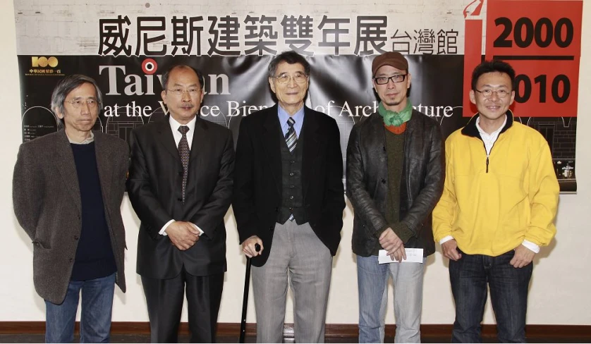five asian businessmen posing with their names on the banner