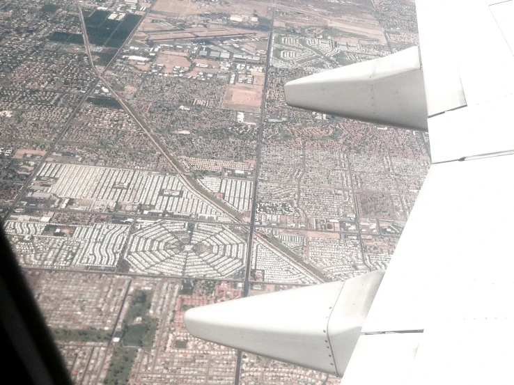 view out of the window on an airplane of a city