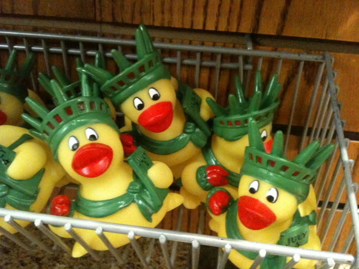 several rubber ducky are sitting on the wire rack
