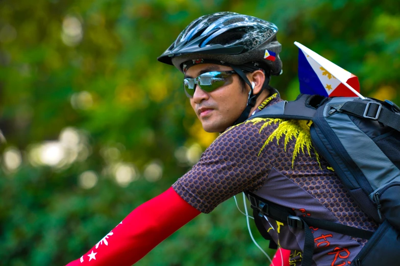 this guy is wearing some kind of colorful helmet