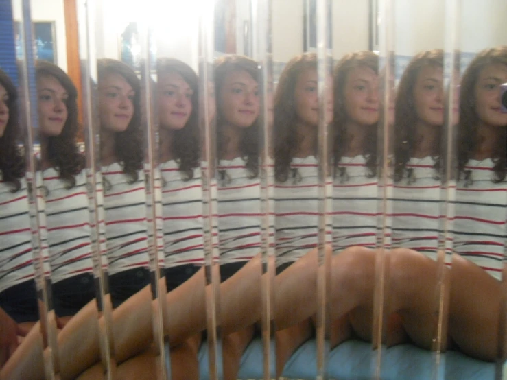 a woman taking a selfie in a mirror