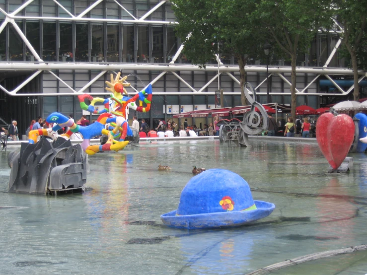 several water features with children and adults floating in them