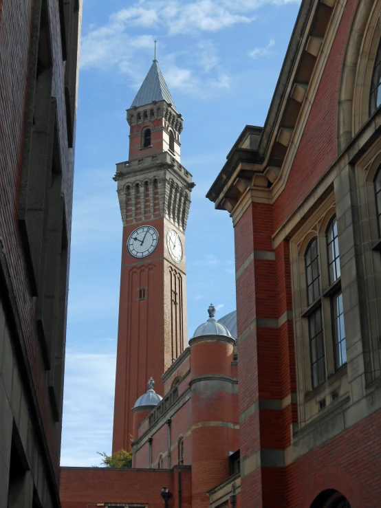 a clock tower is shown towering over buildings