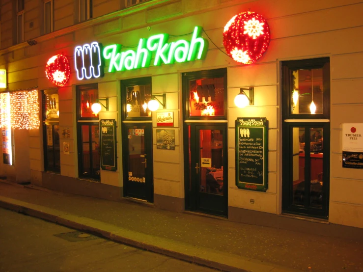 the front window of a restaurant at night