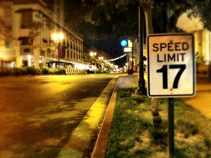 the speed limit sign has a black and white sign