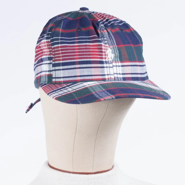 a plaid baseball hat is shown on display