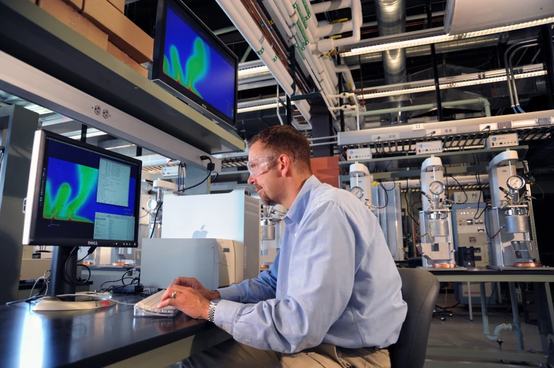 a man working on his computer in the lab