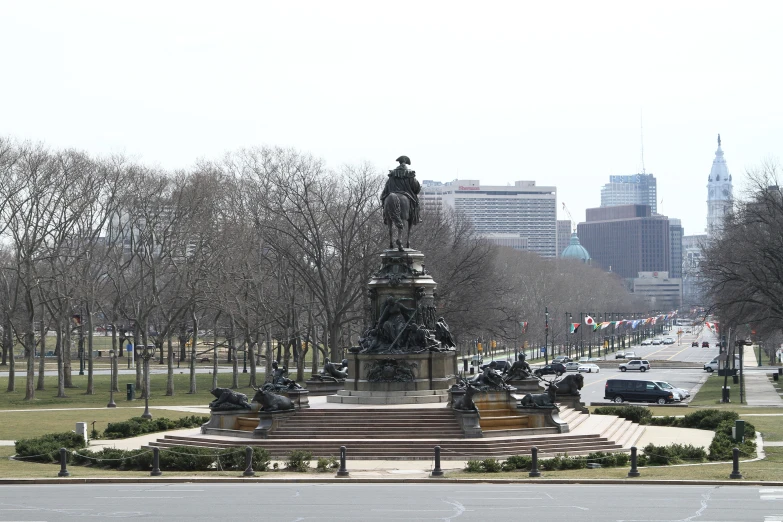 a picture of a statue with a building in the background