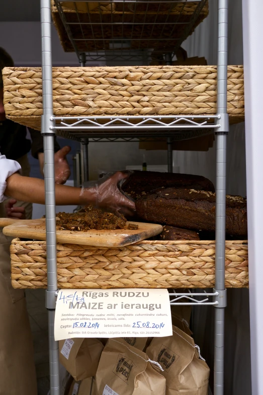 some baskets that are stacked high on a shelf