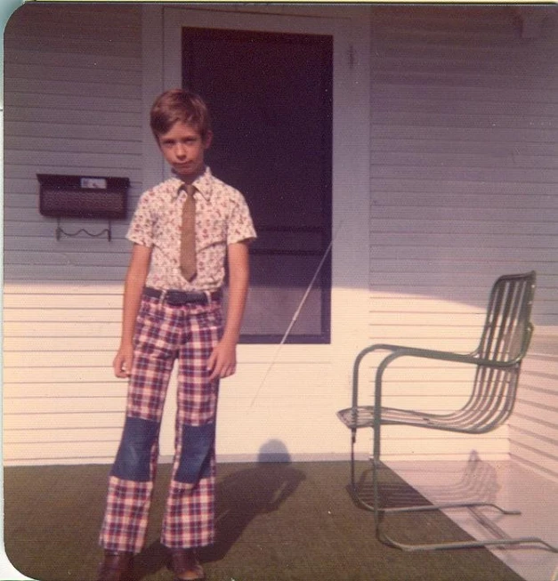 a person standing near some chairs and a building