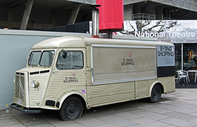 an older food truck parked on the side of the road