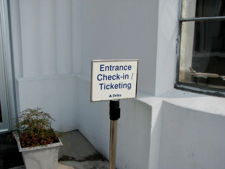 this is an image of a sign in front of the entrance of a building