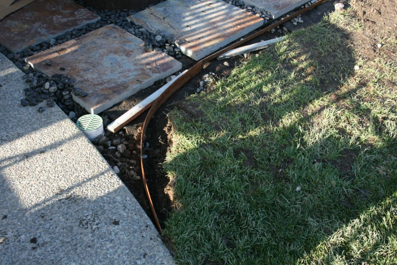 a sidewalk with stone steps on top of it