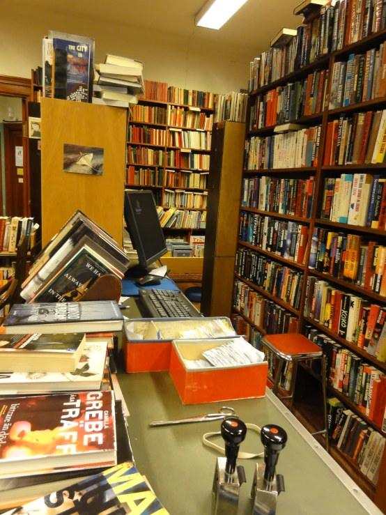 a room filled with lots of books and dvds