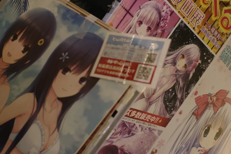 several anime posters with girls standing in a line behind them
