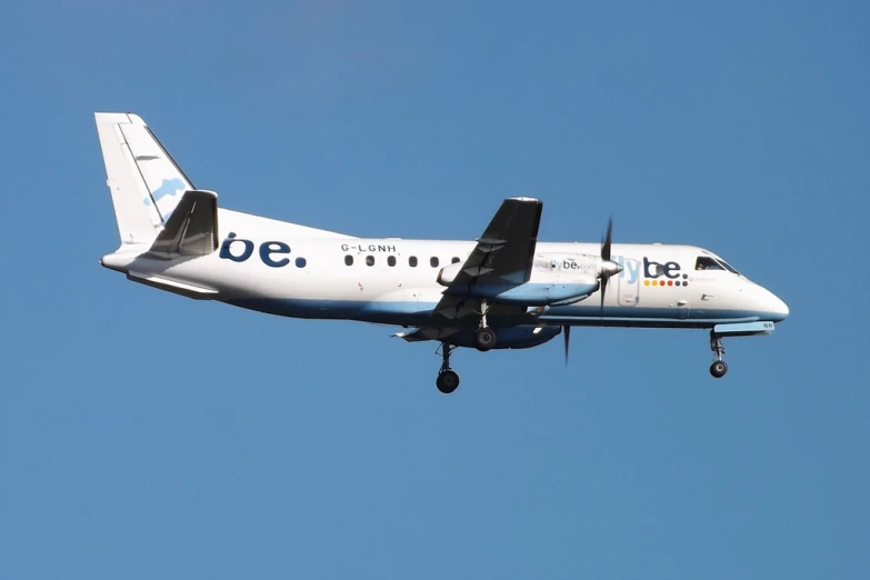 a large jetliner flying through a blue sky