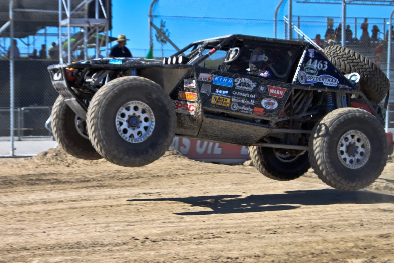 the monster truck is jumping high in the air